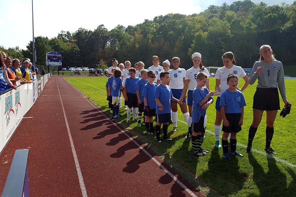 Players line up for the start of the event.