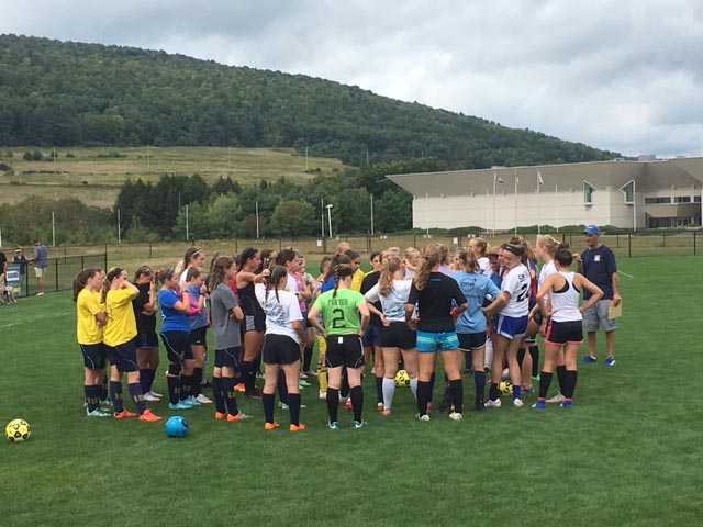 Players huddle before tryouts begin
