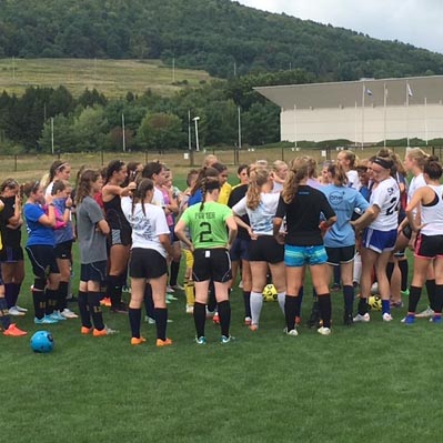 Players huddle before tryouts begin