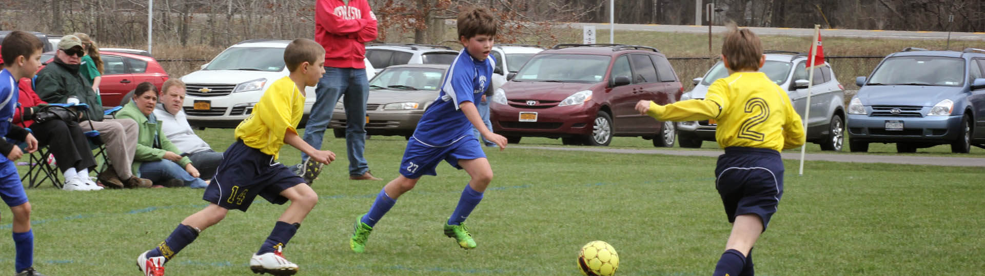 Two OSC boys players persue the ball.